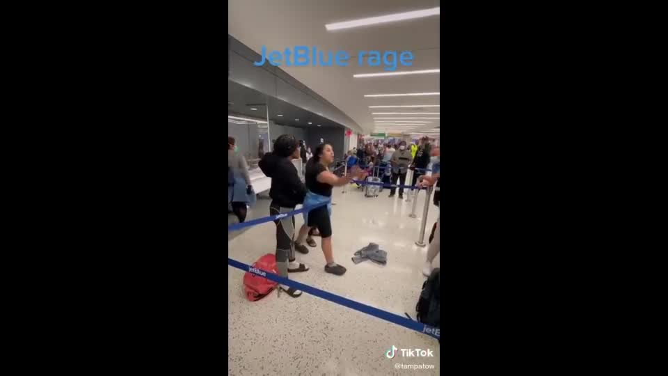 Black Woman Loses It After Jetblue Cancelation, Calls White Man Racial Slurs, Another Black Woman Swoops In To Defend Him