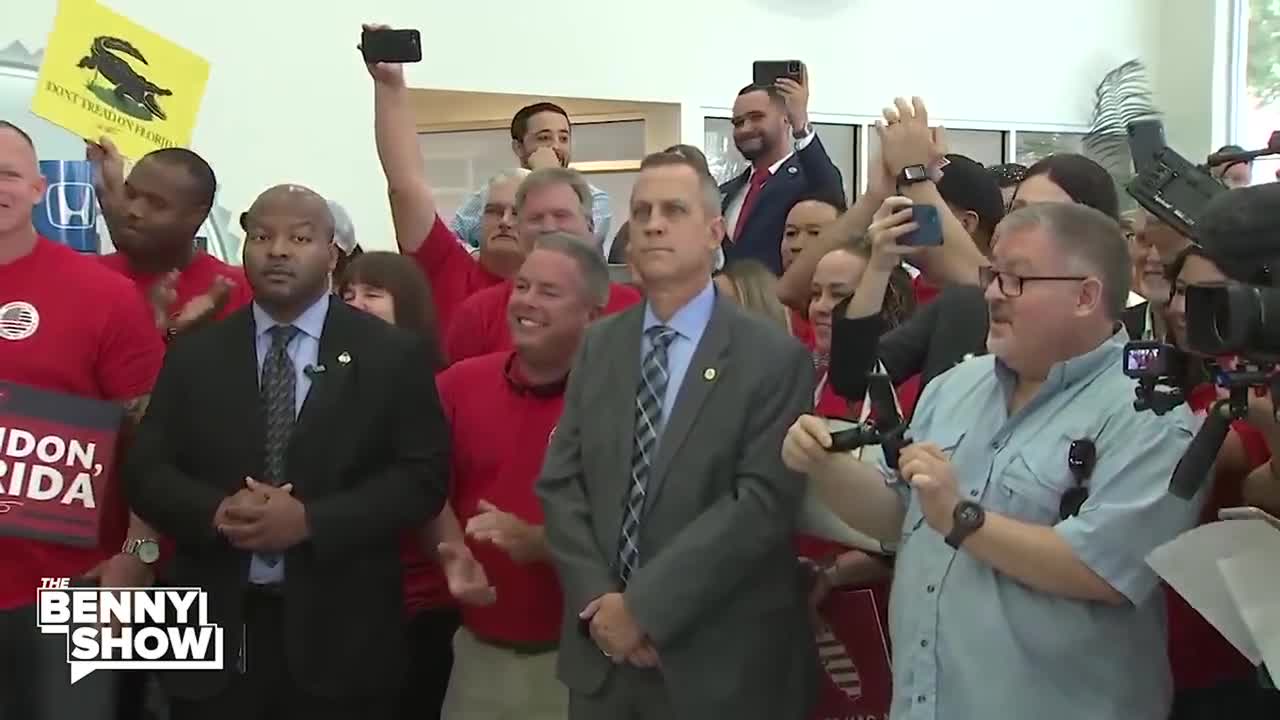 Benny - Thunderous chants of LET'S GO BRANDON erupt at @GovRonDeSantis' bill signing to prevent vaccine mandates in Brandon, FL, DeSantis smiles